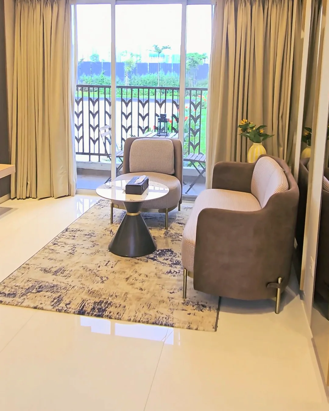 Living room and balcony in the finished 1 BHK sample flat at Unimax Life